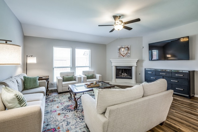 living room with vaulted ceiling, dark hardwood / wood-style flooring, and ceiling fan