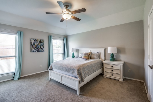 carpeted bedroom with multiple windows and ceiling fan