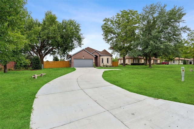 view of front of house featuring a front lawn and a garage