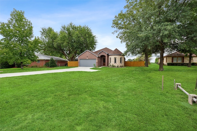 ranch-style home featuring a garage and a front lawn