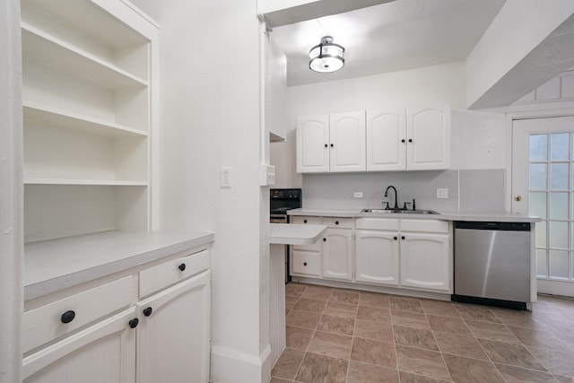 kitchen featuring dishwasher, sink, and white cabinets