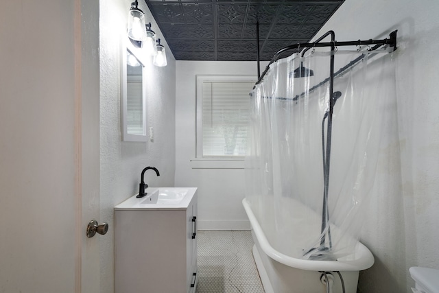 full bathroom featuring vanity, toilet, plus walk in shower, and tile patterned flooring