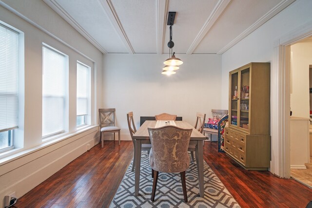 dining space featuring crown molding and dark hardwood / wood-style flooring