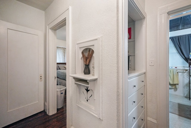 corridor featuring dark hardwood / wood-style flooring