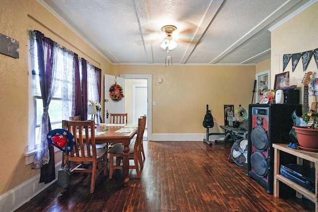 dining space with a textured ceiling, ceiling fan, dark hardwood / wood-style floors, and ornamental molding