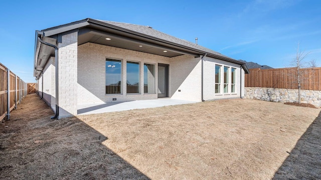 rear view of house with a patio area