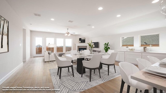 dining room featuring lofted ceiling and ceiling fan