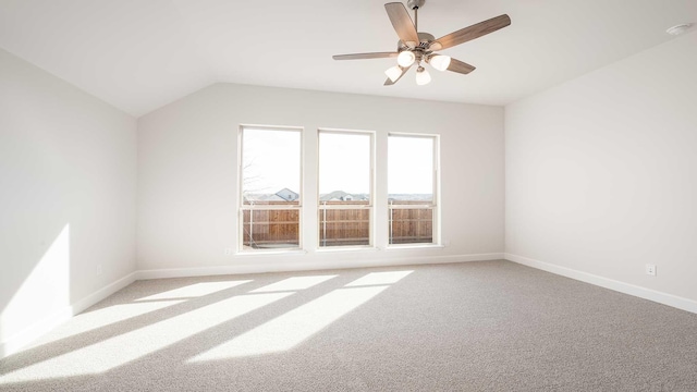 additional living space featuring ceiling fan, light colored carpet, and lofted ceiling