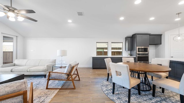 dining space featuring vaulted ceiling and ceiling fan