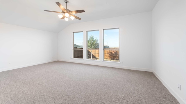 interior space with carpet flooring, vaulted ceiling, and ceiling fan