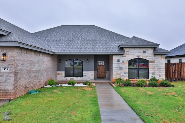 french provincial home featuring a front lawn