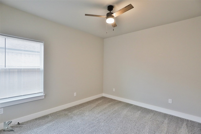 spare room featuring carpet and ceiling fan