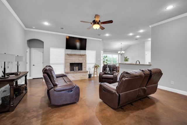 living room featuring ceiling fan with notable chandelier, ornamental molding, and a stone fireplace