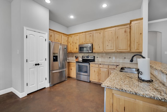 kitchen featuring light stone countertops, light brown cabinetry, appliances with stainless steel finishes, tasteful backsplash, and ornamental molding