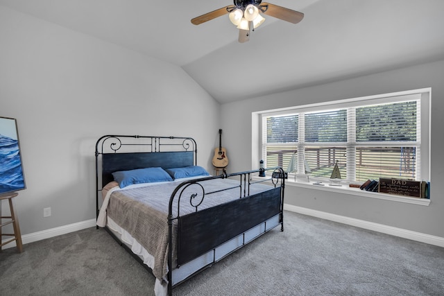 carpeted bedroom featuring ceiling fan and vaulted ceiling