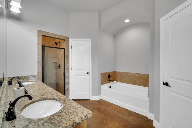 bathroom with tile patterned floors, shower with separate bathtub, and vanity