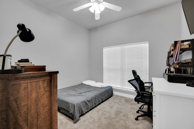 bedroom with light colored carpet and ceiling fan