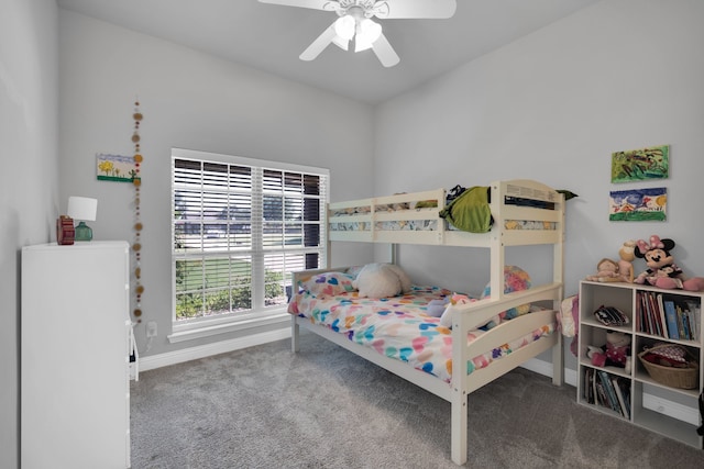 bedroom featuring ceiling fan and carpet