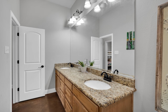 bathroom featuring vanity and concrete floors