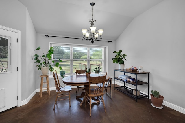 dining area featuring lofted ceiling and an inviting chandelier