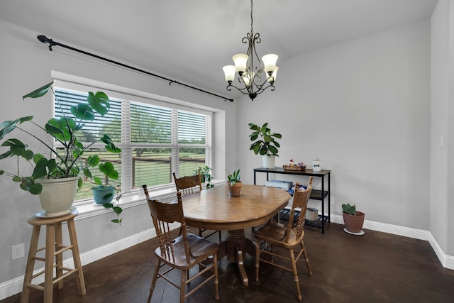 dining room with lofted ceiling and an inviting chandelier