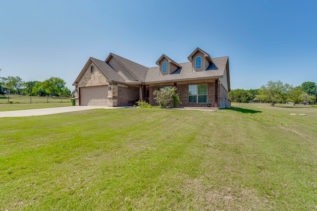 view of front facade with a garage and a front yard