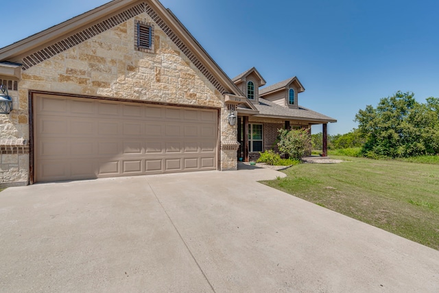 view of front facade with a garage and a front yard