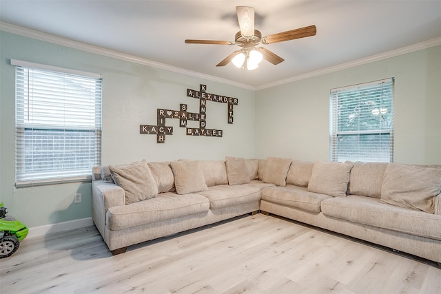 living room featuring light hardwood / wood-style flooring, ceiling fan, and ornamental molding