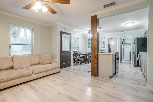 living room featuring ornamental molding, ceiling fan, and light hardwood / wood-style floors