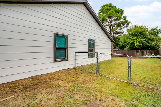 view of property exterior with a lawn