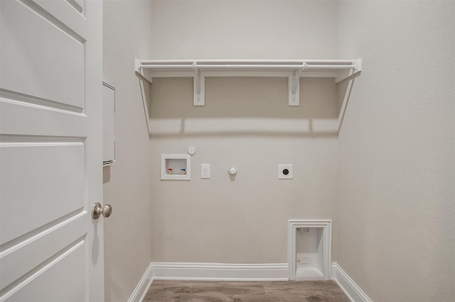 clothes washing area featuring hookup for a washing machine, gas dryer hookup, hookup for an electric dryer, and hardwood / wood-style floors