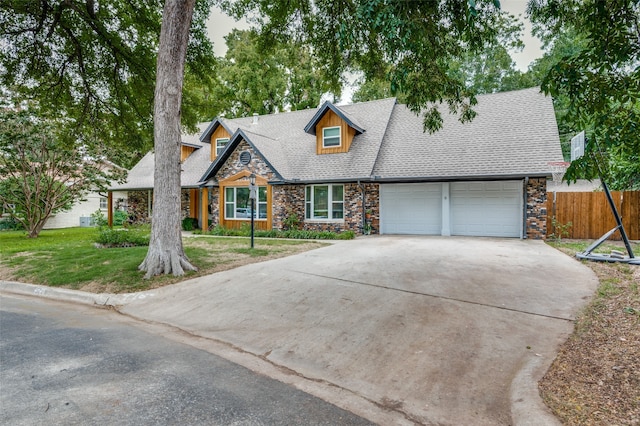 view of front of property with a garage and a front yard