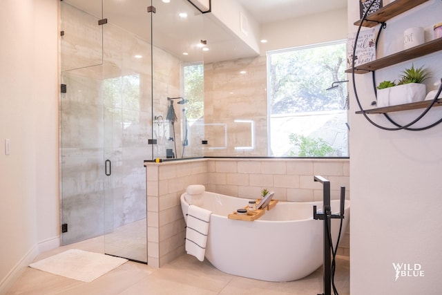 bathroom featuring tile walls and plus walk in shower