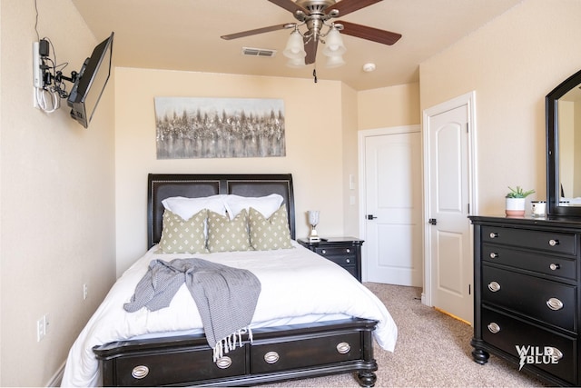 bedroom with light carpet and ceiling fan