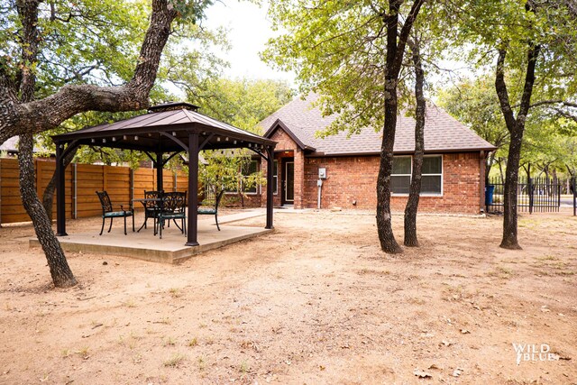 view of yard with a gazebo and a patio area