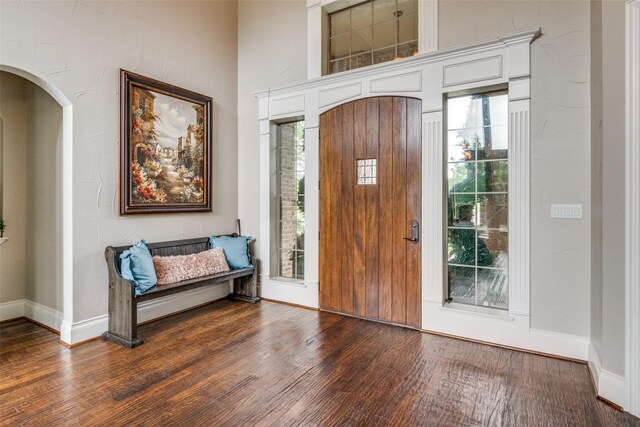 entryway with dark wood-type flooring