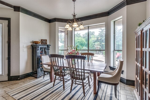 dining space with a chandelier and crown molding