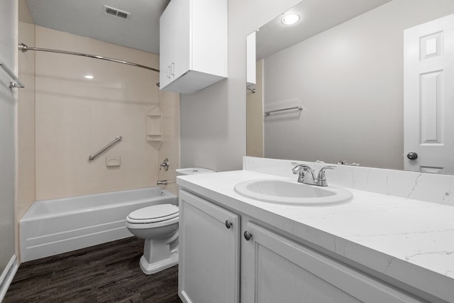 full bathroom with  shower combination, wood-type flooring, vanity, and toilet