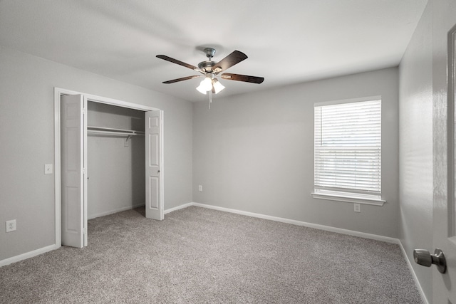 unfurnished bedroom featuring a closet, ceiling fan, and carpet floors