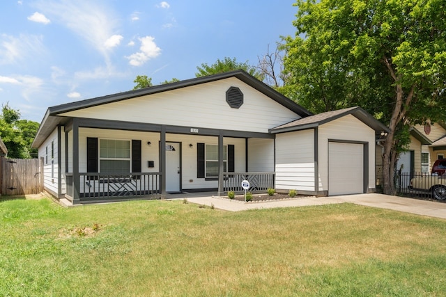 view of front facade with a front lawn, a garage, and a porch