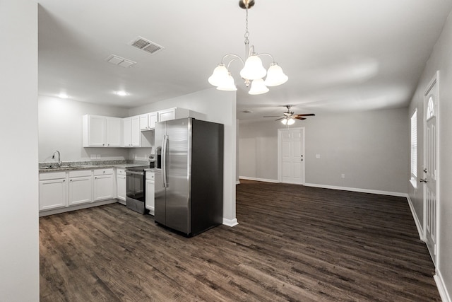 kitchen featuring ceiling fan with notable chandelier, stainless steel appliances, pendant lighting, dark hardwood / wood-style floors, and white cabinetry