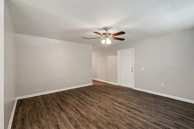 unfurnished room featuring dark hardwood / wood-style flooring and ceiling fan