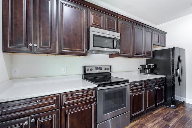 kitchen featuring appliances with stainless steel finishes, dark hardwood / wood-style floors, and ornamental molding