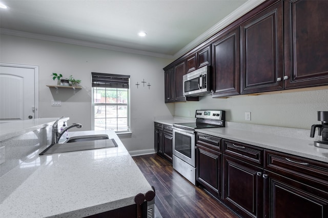 kitchen featuring light stone counters, stainless steel appliances, sink, dark wood-type flooring, and ornamental molding