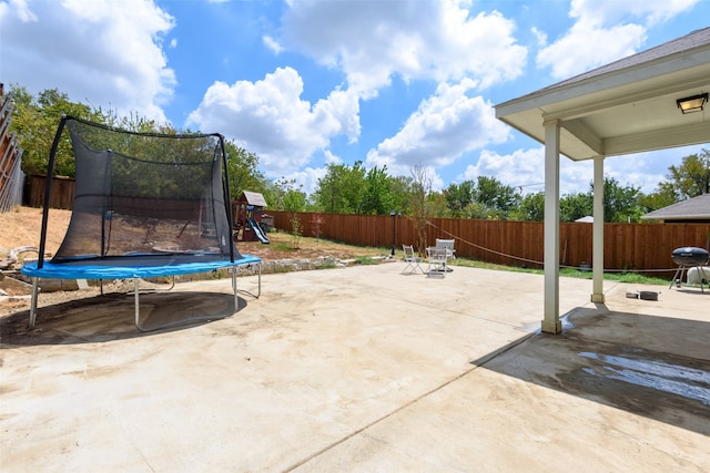 view of patio featuring a grill and a trampoline