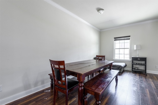 dining area with crown molding and dark wood-type flooring