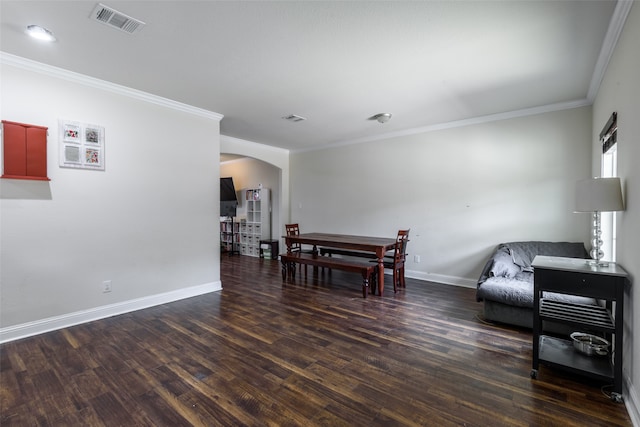 living room with ornamental molding and dark wood-type flooring