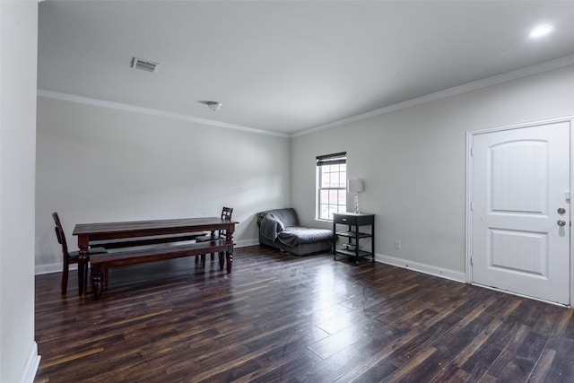 sitting room with dark hardwood / wood-style flooring and crown molding