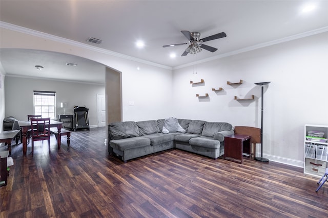 living room with crown molding, ceiling fan, and dark hardwood / wood-style floors