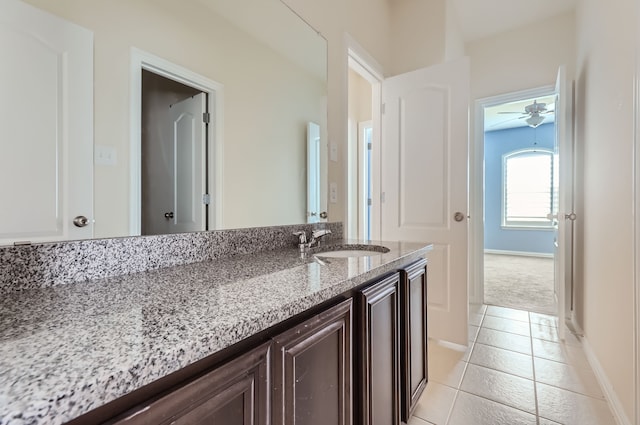 bathroom with ceiling fan, vanity, and tile patterned floors